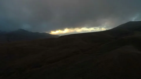 Flight of the camera over a hillside at dusk Stock Footage 86561738