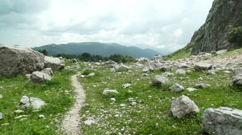 Flight of the Camera Over a Mountain Footpath in a Stones Canyon Video stock 66277679