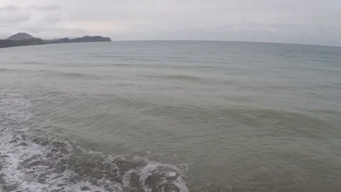 Flight of the camera over the sea in cloudy weather Stock Footage 91396354