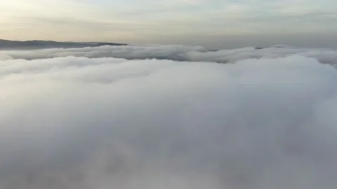 Flight of the camera over the sea of white clouds Stock Footage 144624481
