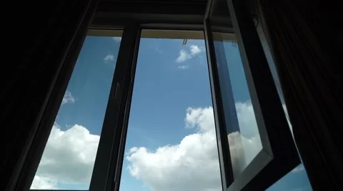 Flight of the Camera Through an Open Window into the Blue Sky With Clouds Stock Footage 64900444