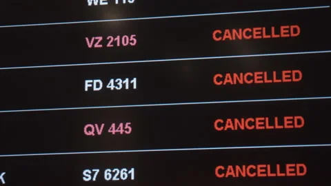Flight cancellations on departure board screen Stock Footage 147498950