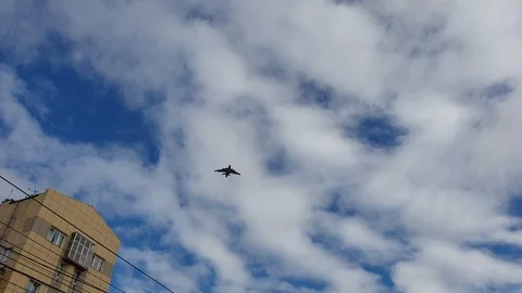 The Flight of a cargo plane in the sky over the city. Stock Footage 105150854