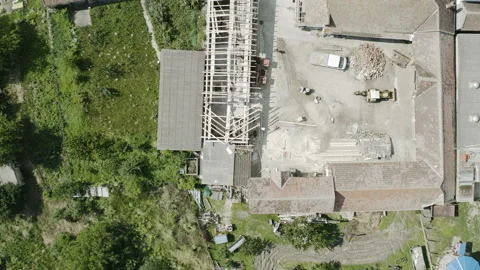 Flight with a circular motion above a constructon site of a unfinished house Stock Footage 137175964