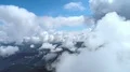 The flight in a cloud stream above picturesque mountains. Hyperlapse 4k or 4k+ Resolution