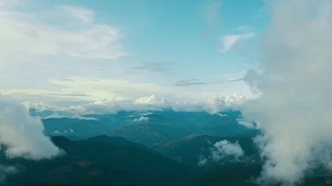 The flight in clouds above beautiful mountain Stock Footage 116057803