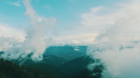 The flight in clouds above beautiful mountain landscape Stock Footage 116058044
