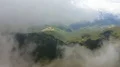 The flight in clouds above the mountain forest. Hyperlapse 4k or 4k+ Resolution