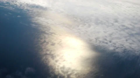 Flight in the clouds above the ocean in 4K Stock Footage 88763563