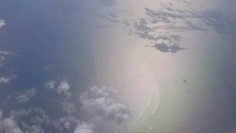 Flight in the clouds above the ocean in 4K Stock Footage 149353200