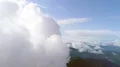 The flight in clouds above picturesque mountains. Hyperlapse 4k or 4k+ Resolution