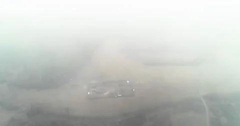 Flight from the clouds to a lonely farm in the forest Video stock 169494337