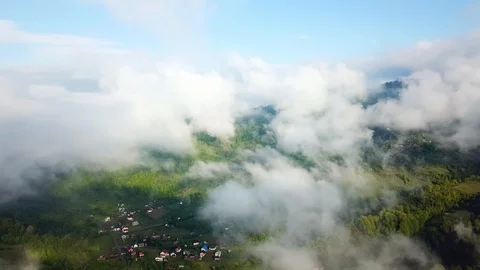 Flight in the clouds in mountains Stock Footage 120647750