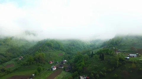 Flight in the clouds in mountains Stock Footage 121379272