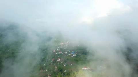 Flight in the clouds in mountains Stock Footage 122080889