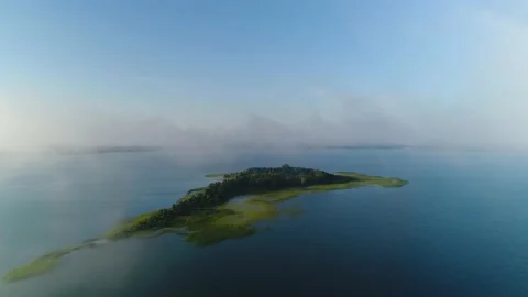 Flight in the clouds over the island of Lake Svityaz. Volyn, Ukraine, Video stock 159730371