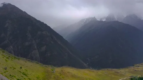Flight in a cloudy mountains towards the gorge Stock Footage 213375059