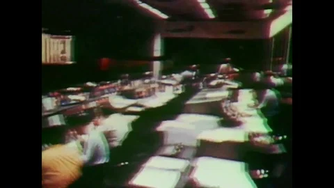 Flight controllers are shown in the Mission Control Center as well as Stock Footage 92751162