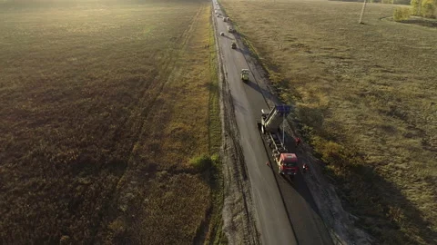 Flight of the copter around the road construction equipment. Road repair Stock-Footage 138532751