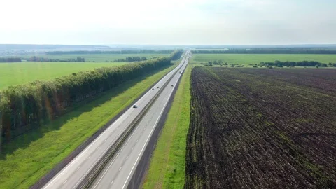 Flight of a copter crossing a two-way road. Stock Footage 119062298