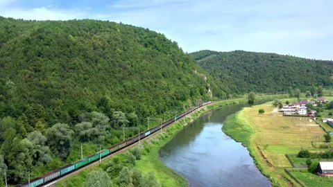 Flight of a copter following a moving freight train. Stock Footage 119069588