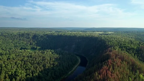 Flight of a copter through a mountain range separating two valleys. Stock Footage 114976669