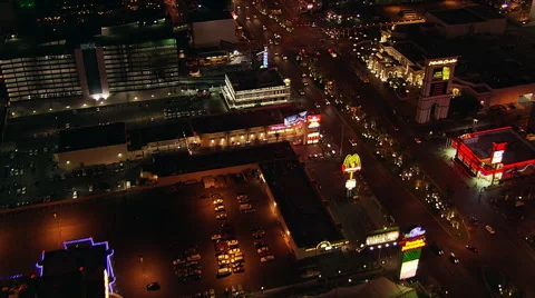 Flight crossing The Strip, over  Excalibur Hotel toward the Luxor in Las Vegas. Stock Footage 59526447