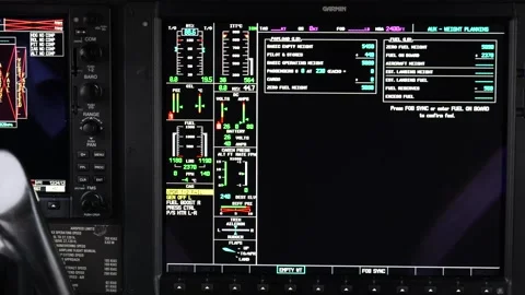 Flight deck shown garmin glass cockpit engine parameters fuel data weight Stock Footage 328999526