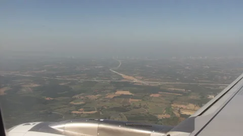 Flight Departure Captured from Window Seat with Wing and Cloud View Stock-Footage 333706397