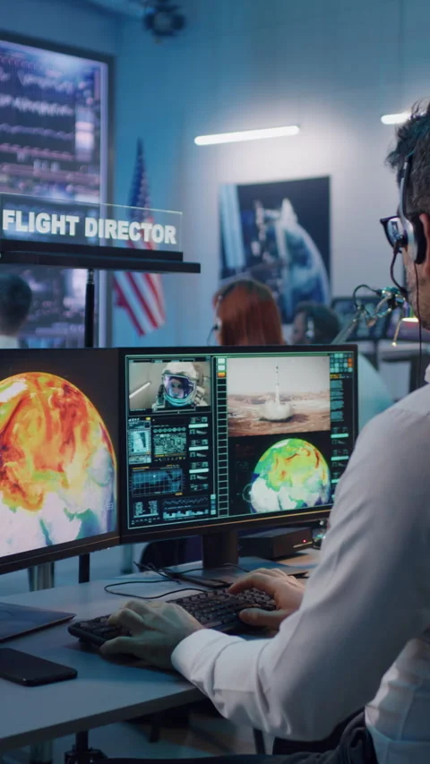 Flight director controlling rocket launch with team Stock Footage 274382834