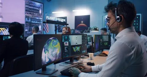 Flight director controlling rocket launch with team Stock Photos