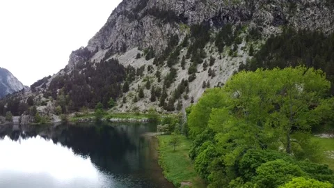 Flight Down Above Lake Ibon de los Banos in Spain Stock Footage 146623511