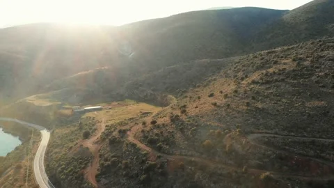 Flight down towards an old barn at sunset Stock Footage 137792541