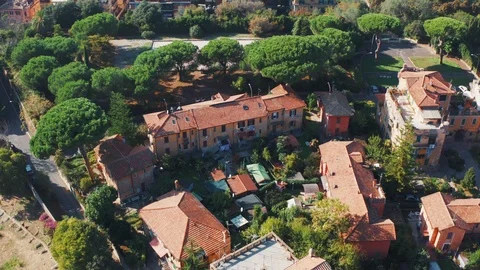 Flight on drone above orange rooftops and green trees in Rome, Italy, aerial 스톡 동영상 119353656