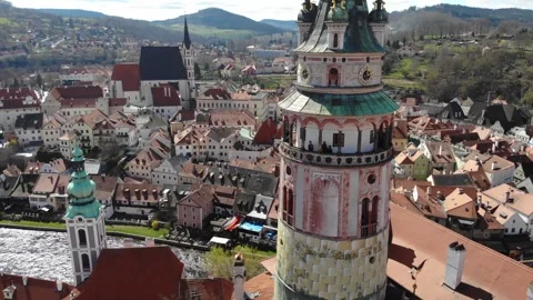 Flight of the drone around the tower of Cesky Krumlov Castle at a sunny day Stock Footage 255780867