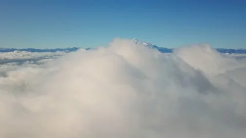 Flight of the drone in the clouds with a view of mount Elbrus - the highest Stock Footage 151771196
