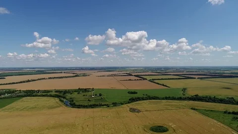 Flight to drone on green and yellow agricultural fields in Russia Stock Footage 82235971