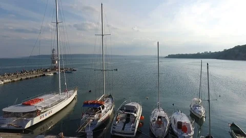 Flight with the drone over the blue sea and yacht port Stock Footage 106680321