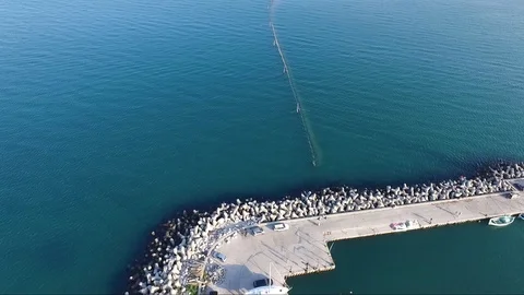 Flight with the drone over the blue sea and yacht port 動画素材 106680368