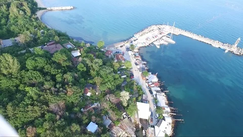 Flight with the drone over the blue sea and yacht port Stock Footage 106680962