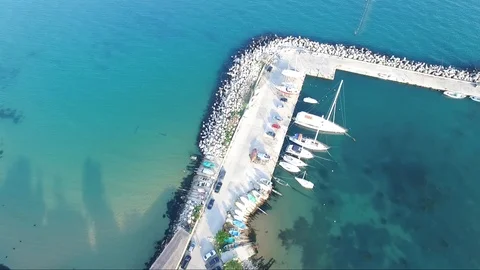 Flight with the drone over the blue sea and yacht port 動画素材 106680977