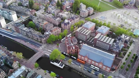 Flight of a drone over canals and the historic center of Amsterdam Stock Footage 144451307