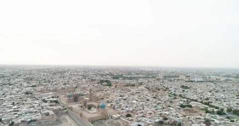 The flight of the drone over the famous old ancient Ark fortress in Bukhara at Stock Footage 247902468