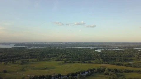 Flight of the drone over the fields and rivers 動画素材 76999978