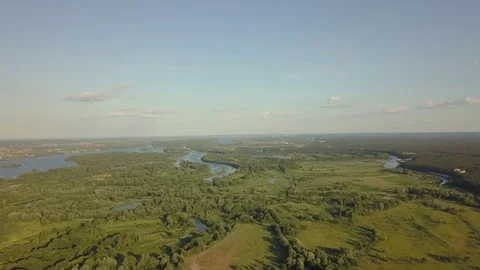 Flight of the drone over the fields and rivers 動画素材 77000100