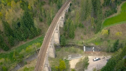 Flight of drone over the forest, railway bridge. Stock Footage 92832376