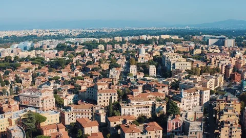 Flight on drone over orange roofs of houses and buildings in Rome, Italy. Aerial Stock Footage 119353649