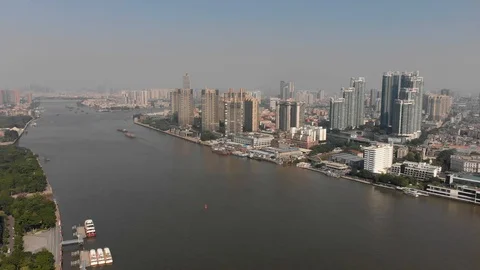 Flight of a drone, over a river in a big city. Stock Footage 118242555