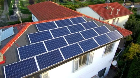 Flight drone over solar panels on the roof of the house 4K Stock Footage 80927819