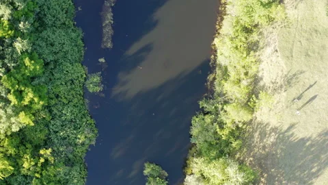 Flight with a drone over a tight river canal Stock Footage 134605191